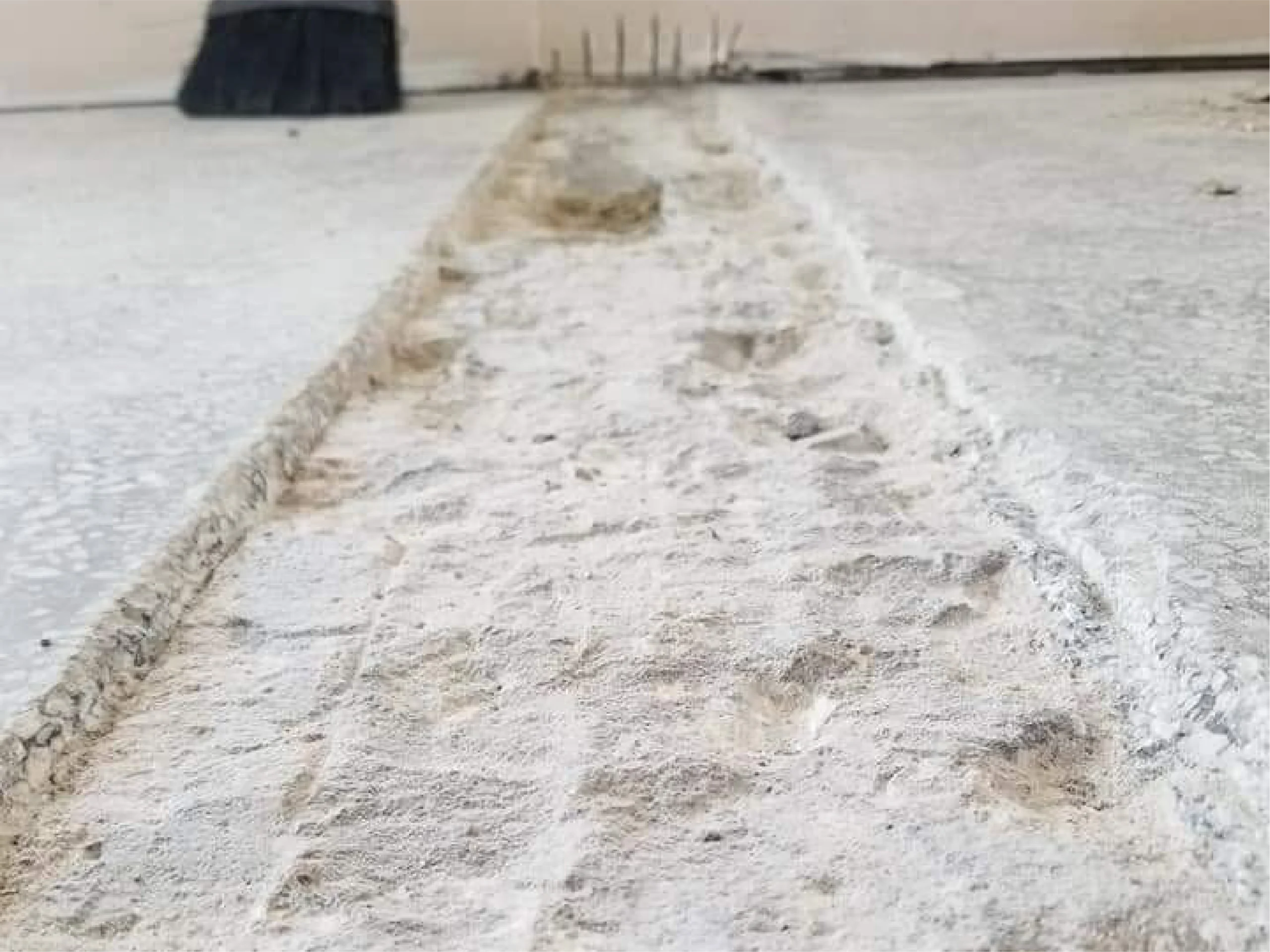 Close up of Terrazzo floor strip before restoration